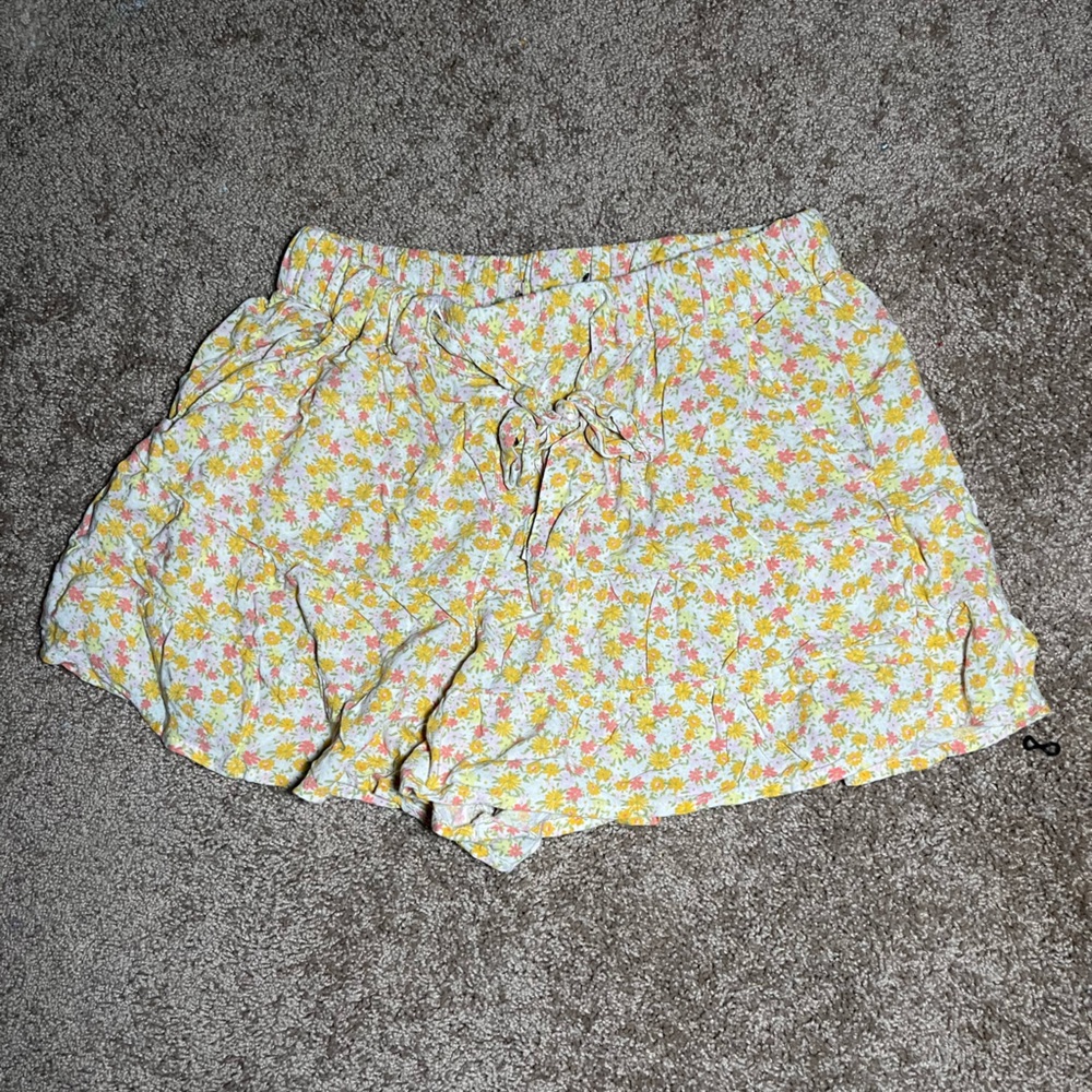 These yellow floral floaty, pair of shorts are so soft and have a tie